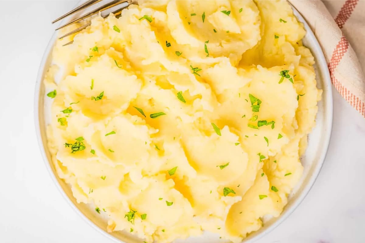 A dish of Creamy Microwave Mashed Potatoes.