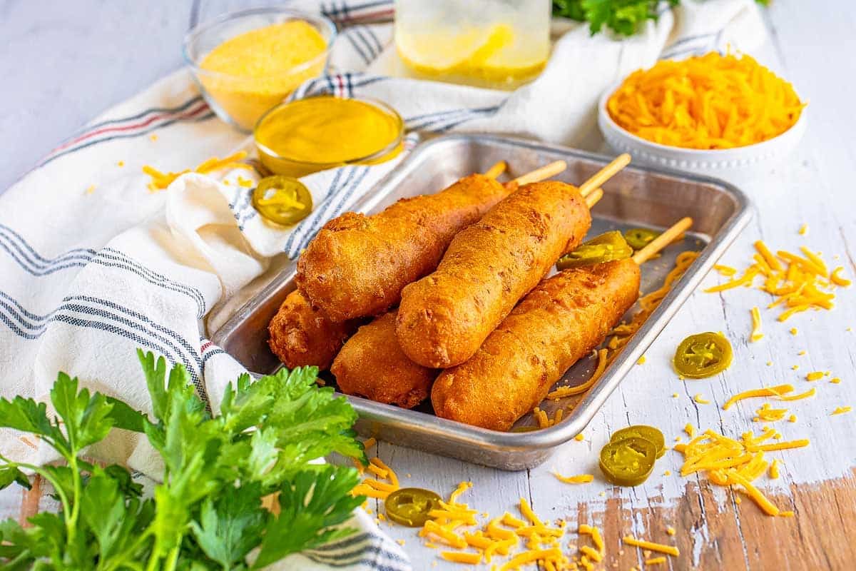 A dish of Cheesy Jalapeño Corn Dogs.