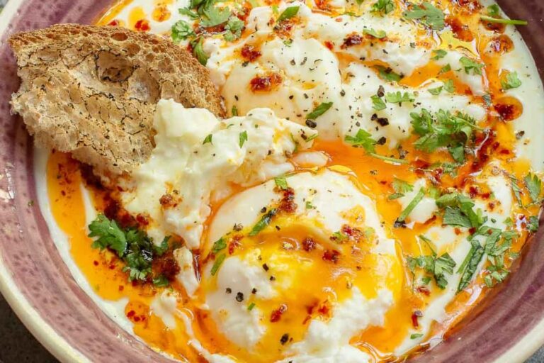 A dish of Turkish Eggs with Garlic Yogurt.