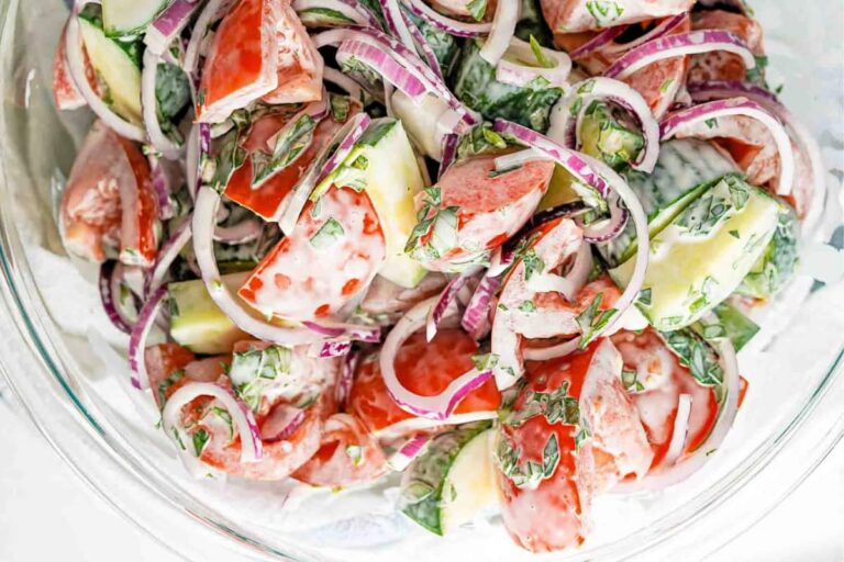 A bowl of Creamy Cucumber Tomato Salad.