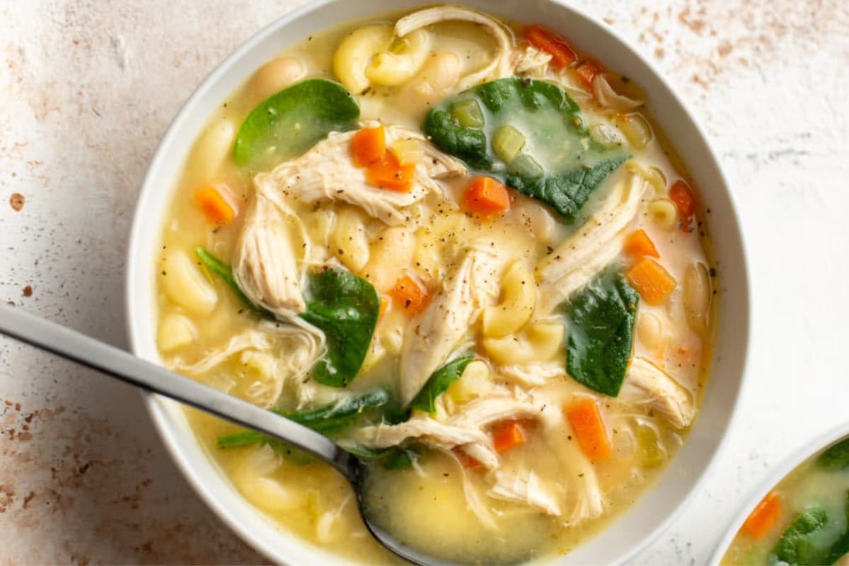 A bowl of Lemon Chicken White Bean Soup.