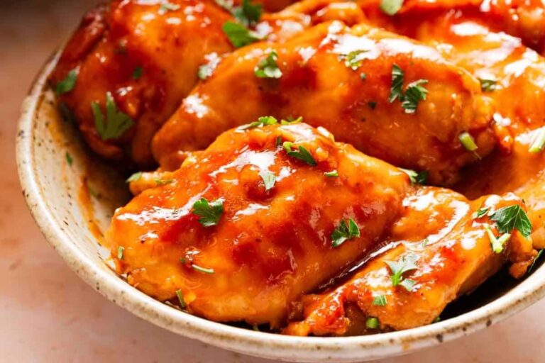A plate of Slow Cooker BBQ Chicken Thighs.