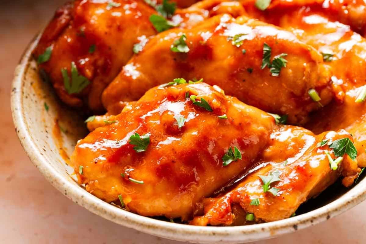 A plate of Slow Cooker BBQ Chicken Thighs.