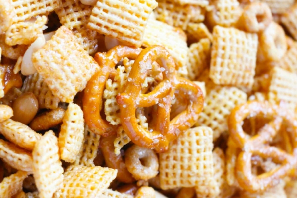 A bowl of Honey Glazed Crockpot Chex Mix.