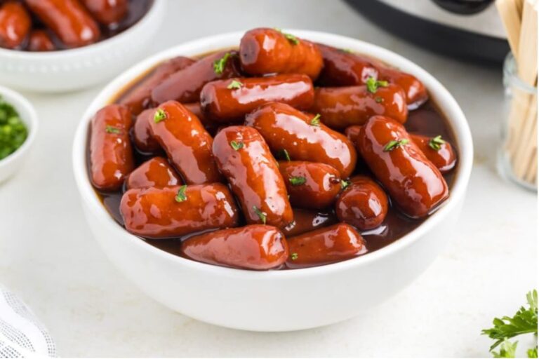 A bowl of Little Smokies with Grape Jelly.
