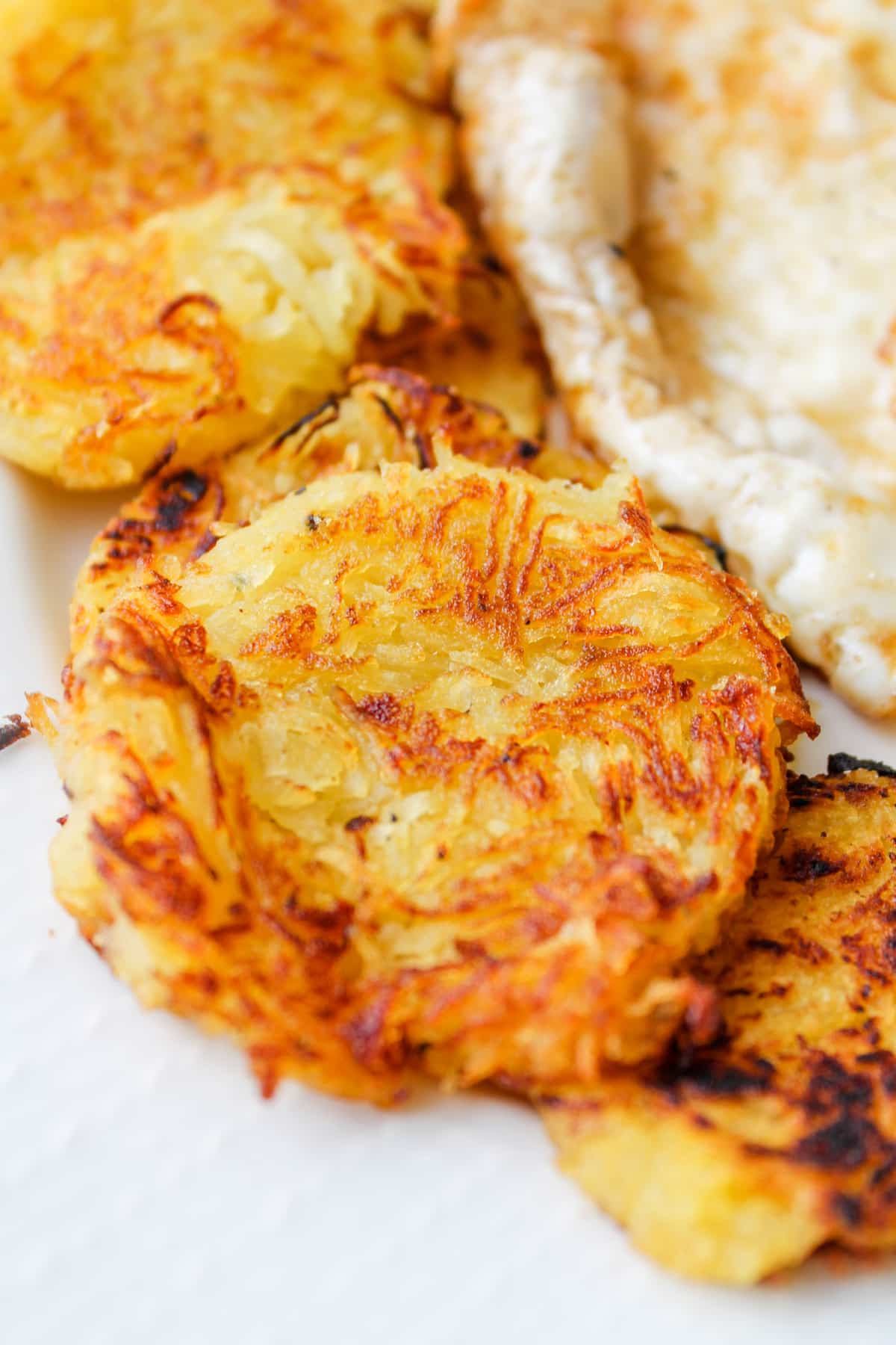 A plate of spaghetti squash hash browns.
