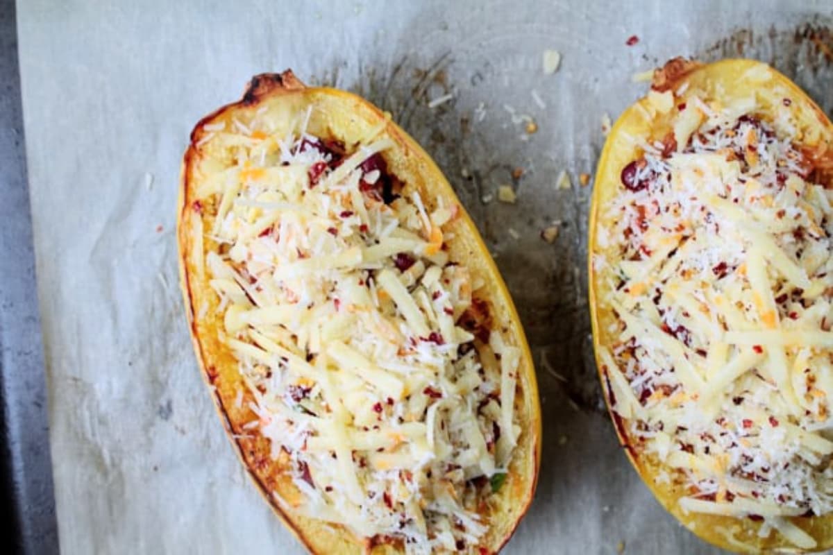 A tray of stuffed spaghetti squash about to go in the oven.