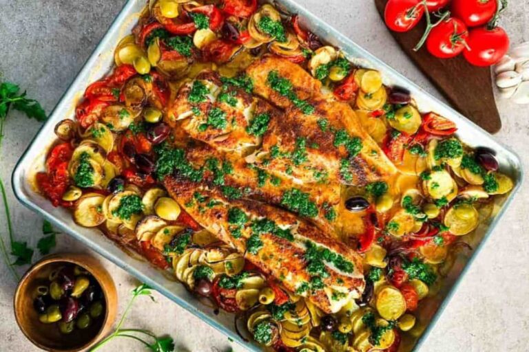 A dish of Sheet Pan Cod with Lemon Herb Sauce.