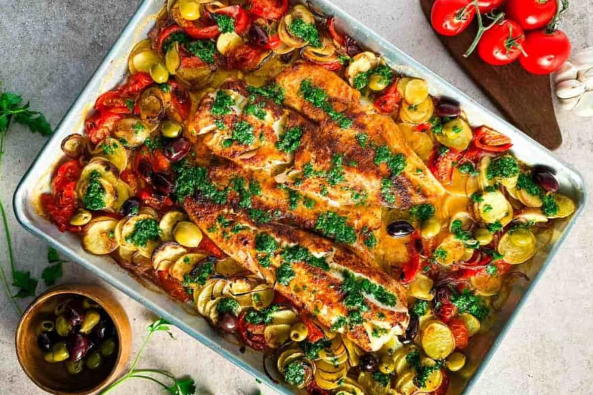 A dish of Sheet Pan Cod with Lemon Herb Sauce.