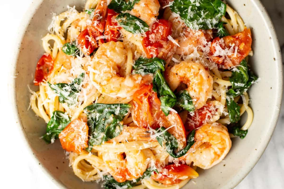 A dish of Tomato Spinach Shrimp Pasta.