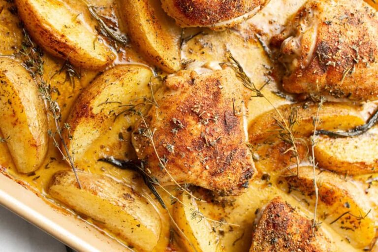 A dish of Sheet Pan Baked Chicken and Potatoes.