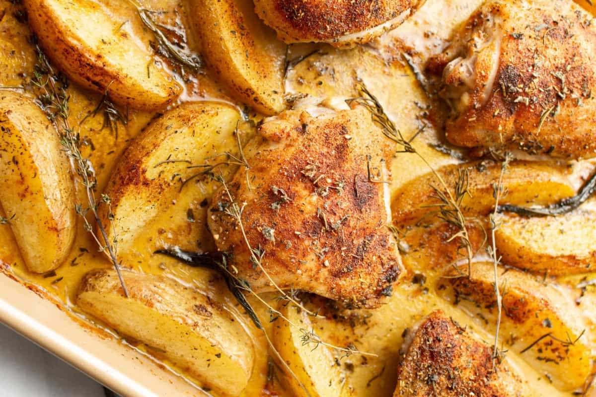 A dish of Sheet Pan Baked Chicken and Potatoes.