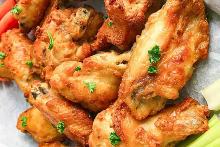 A plate of Frozen Chicken Wings in an Air Fryer.