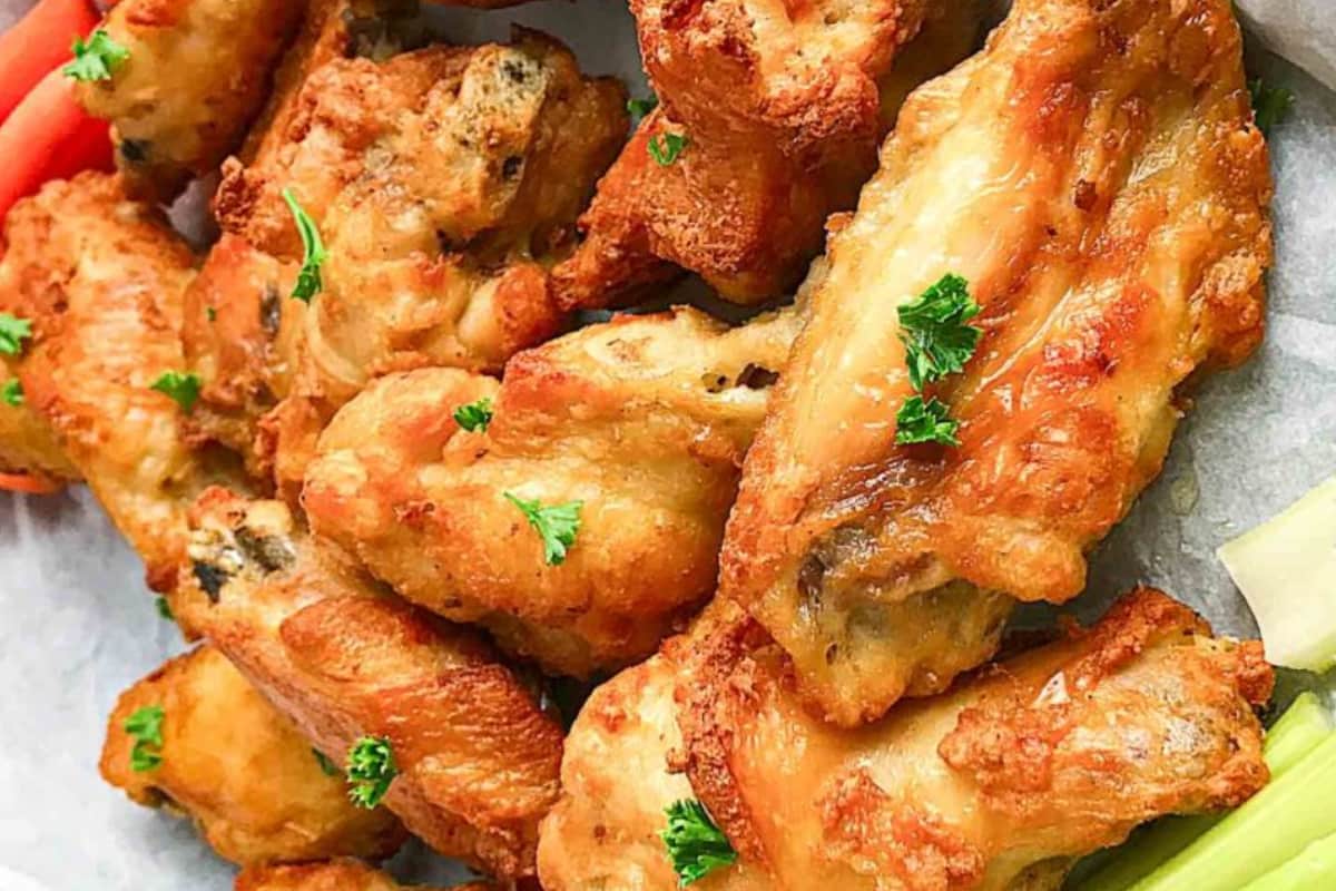 A plate of Frozen Chicken Wings in an Air Fryer.