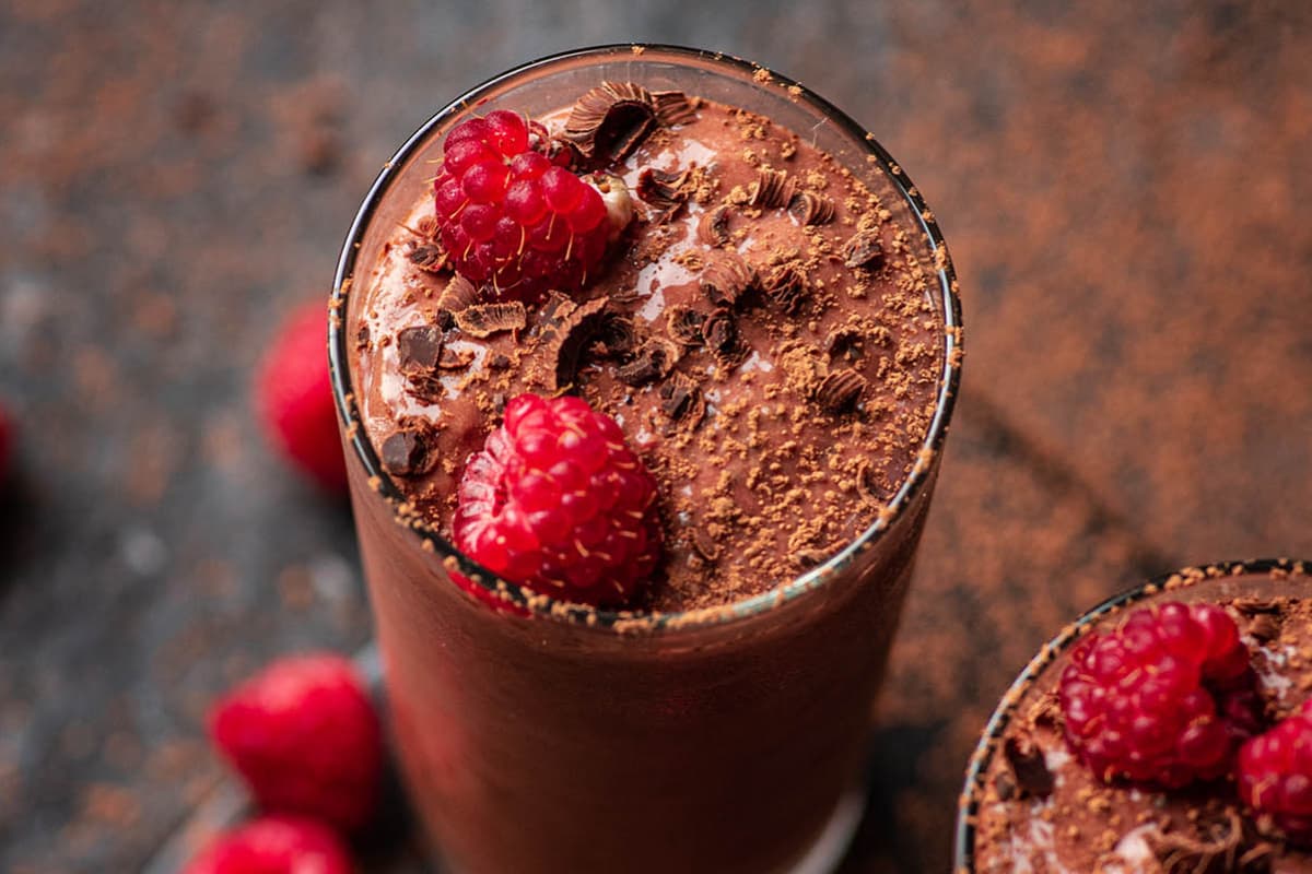 A glass of Dark Chocolate Raspberry Protein Shake.