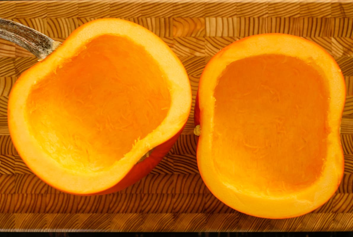 Halved pumpkins with the insides scraped out.