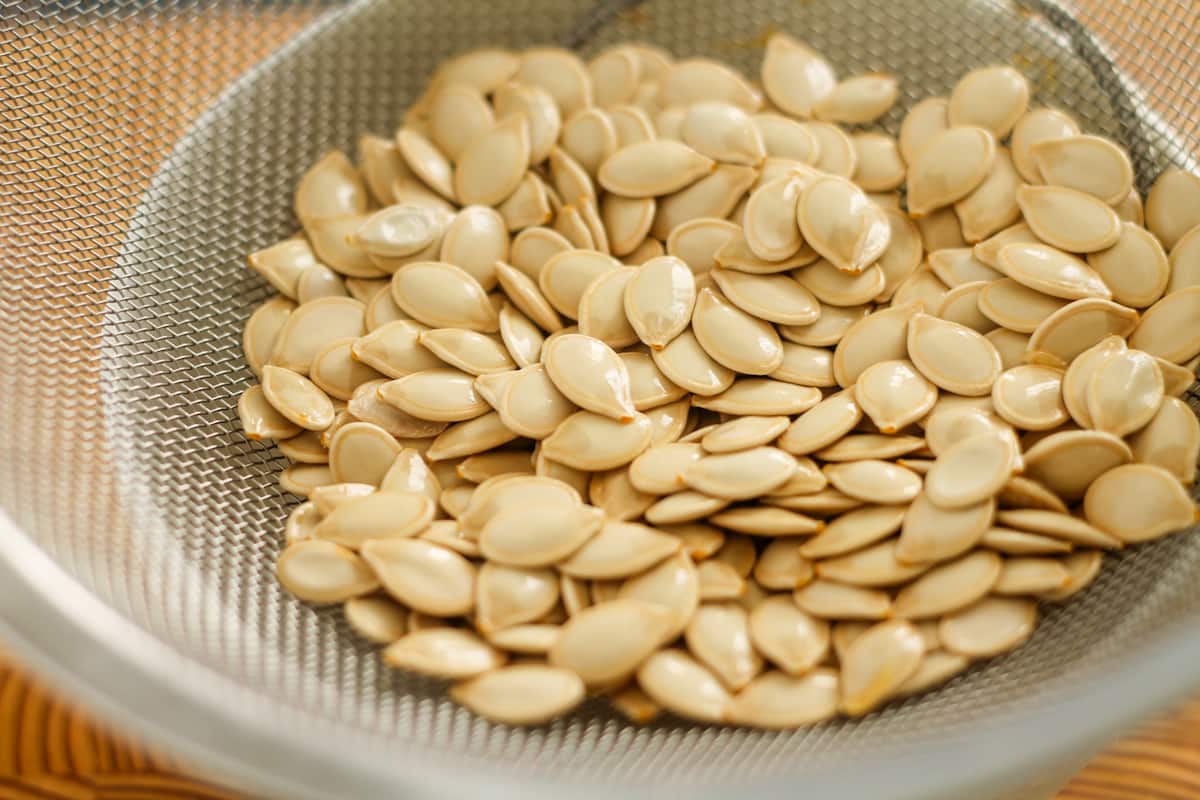Pumpkin seeds in a sieve.