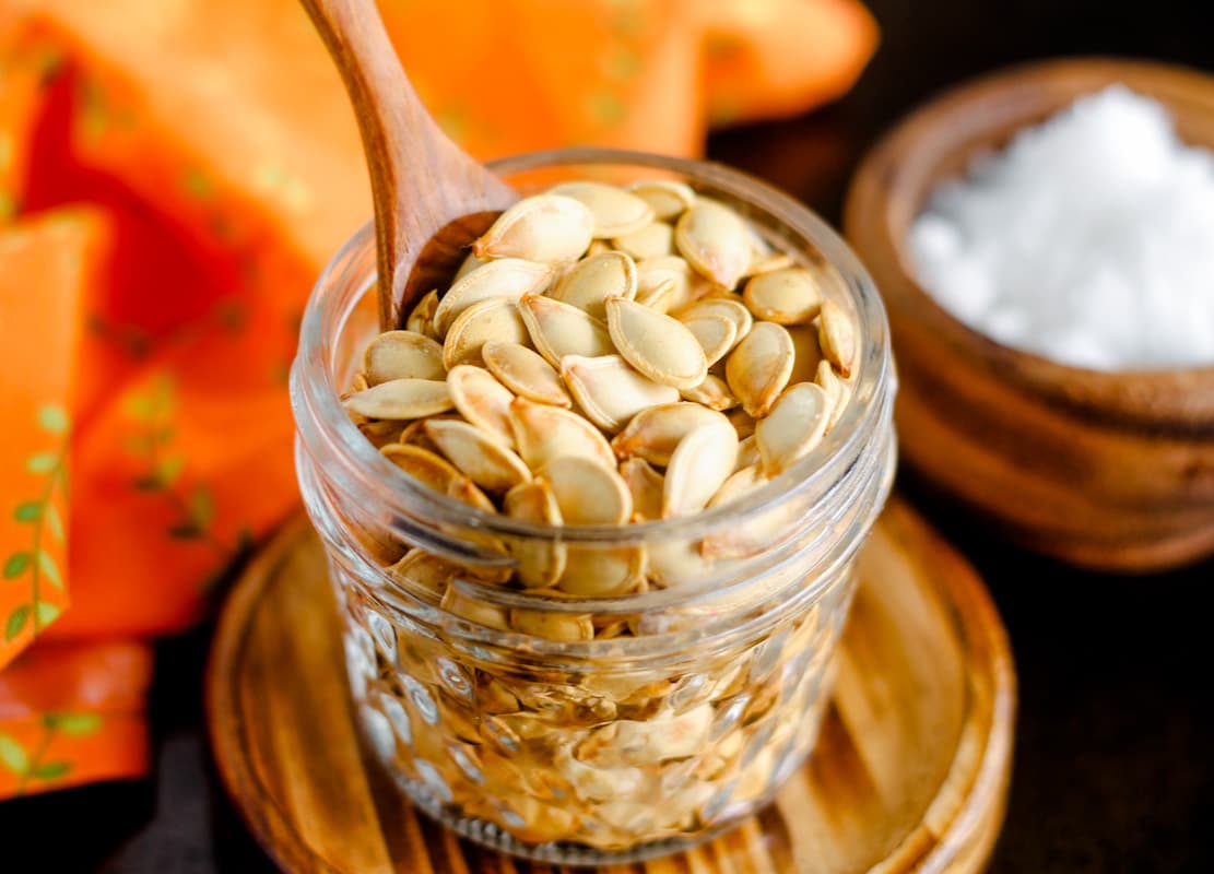 A dish of roasted pumpkin seeds.