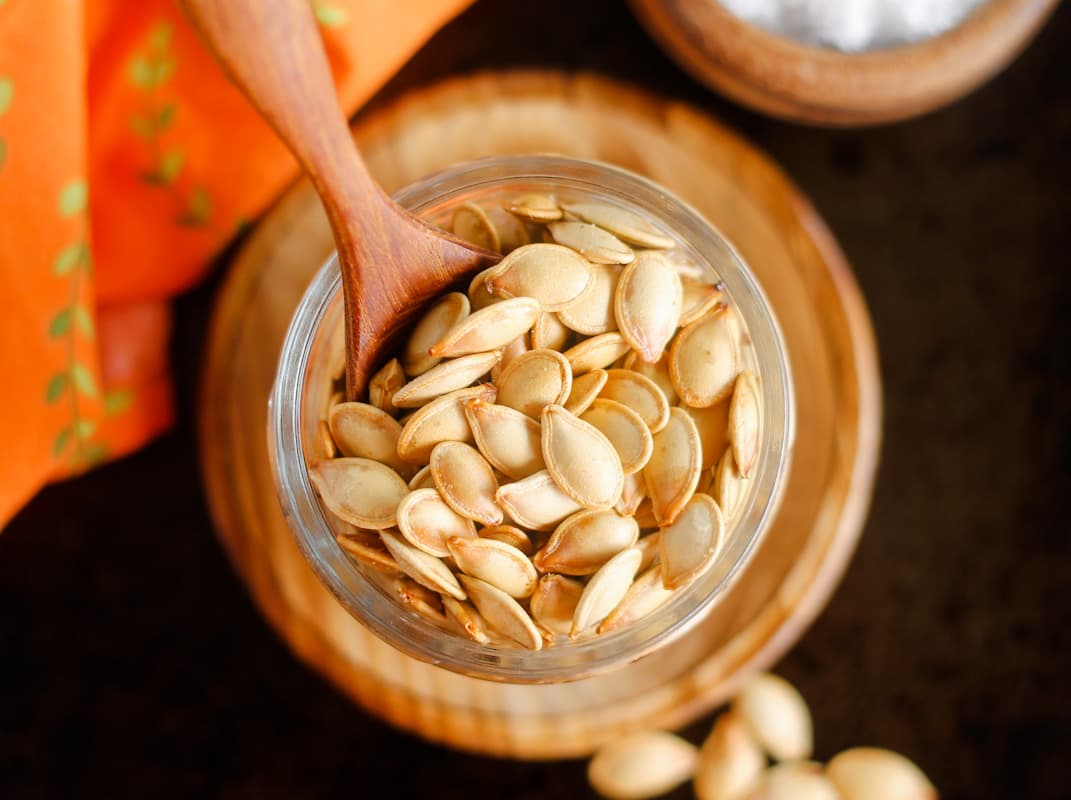 A dish of roasted pumpkin seeds.