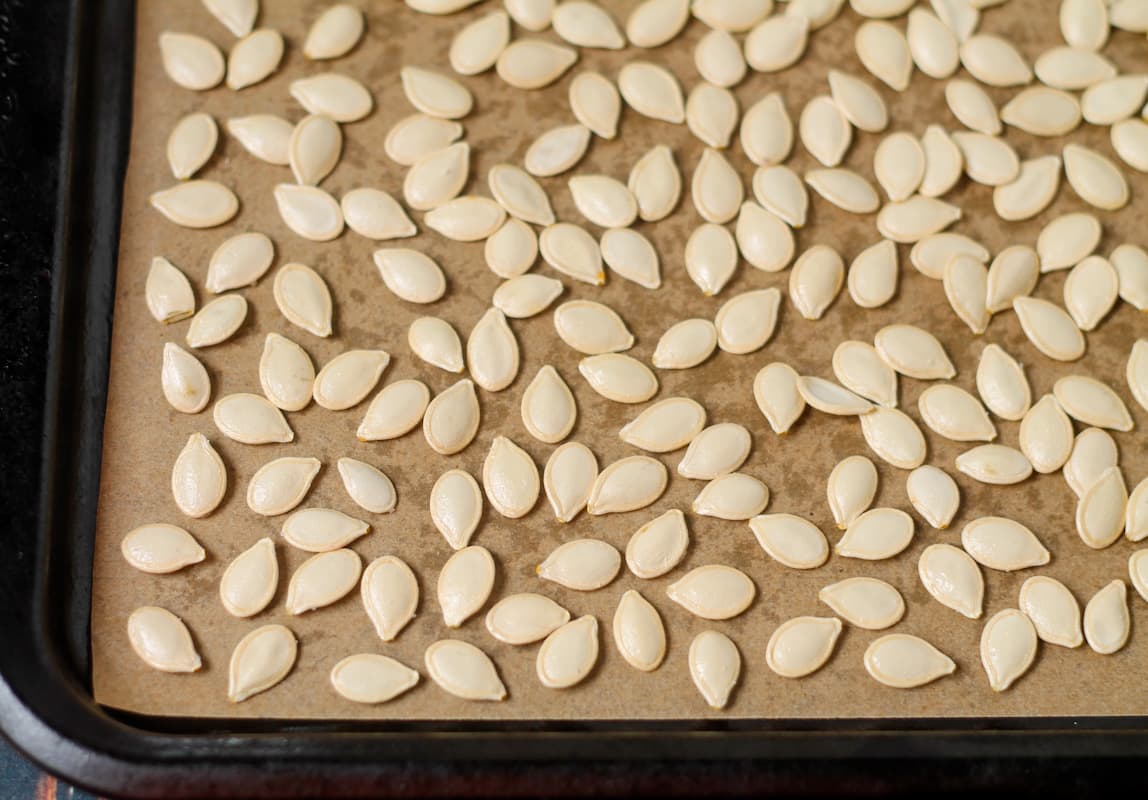 Seeds on a baking sheet.