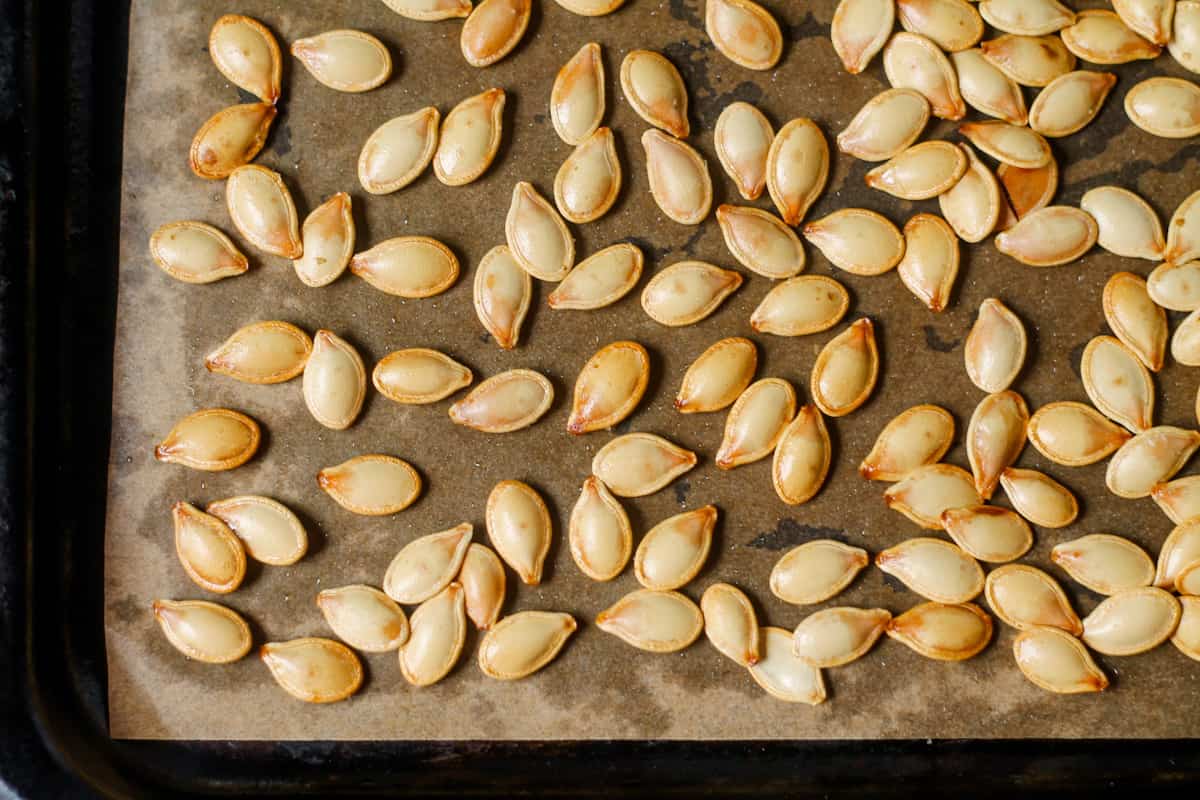 Roasted seeds on a baking sheet.