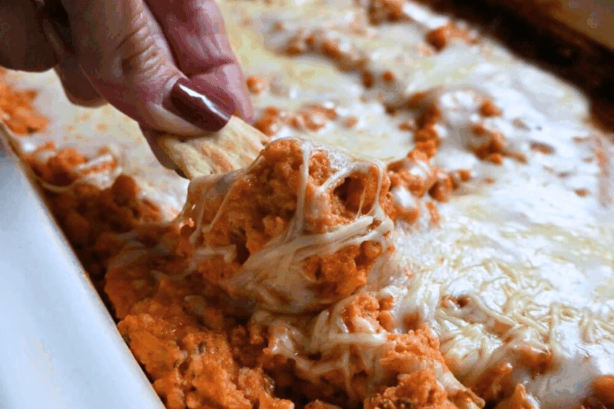 A dish of Slow Cooker Chicken Parmesan Dip.