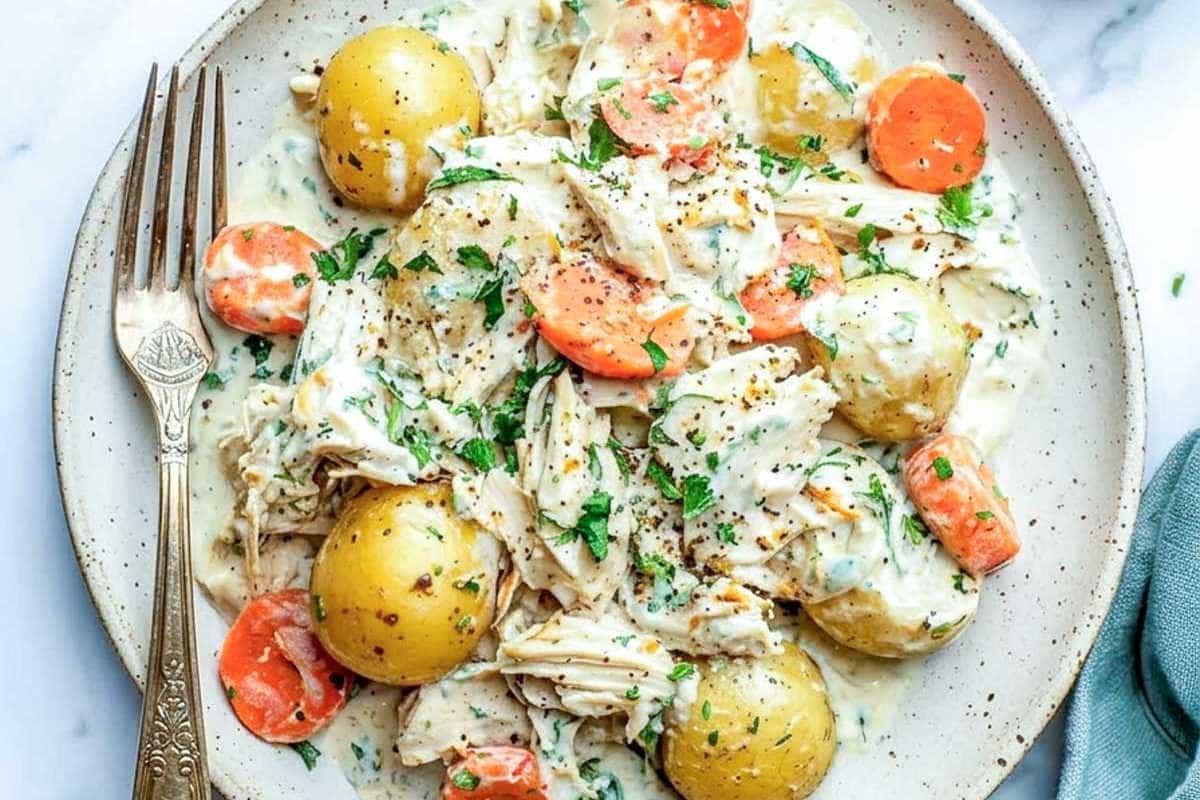 A plate of Crockpot Ranch Chicken and Potatoes.