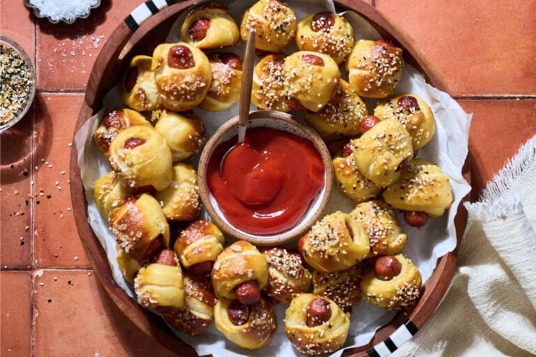 A dish of Sourdough Discard Pretzel Pigs in a Blanket.