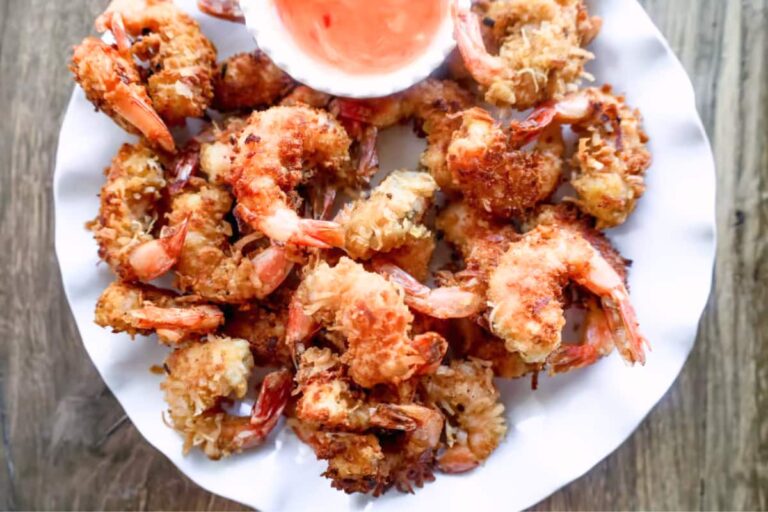 A plate of Crispy Coconut Shrimp with Sweet Chili Sauce.