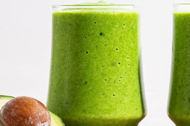 A glass of Green Avocado Spinach Smoothie.