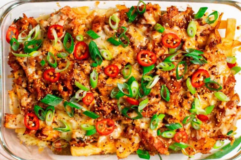 A dish of Cheesy Kimchi Fries Loaded with Bacon.