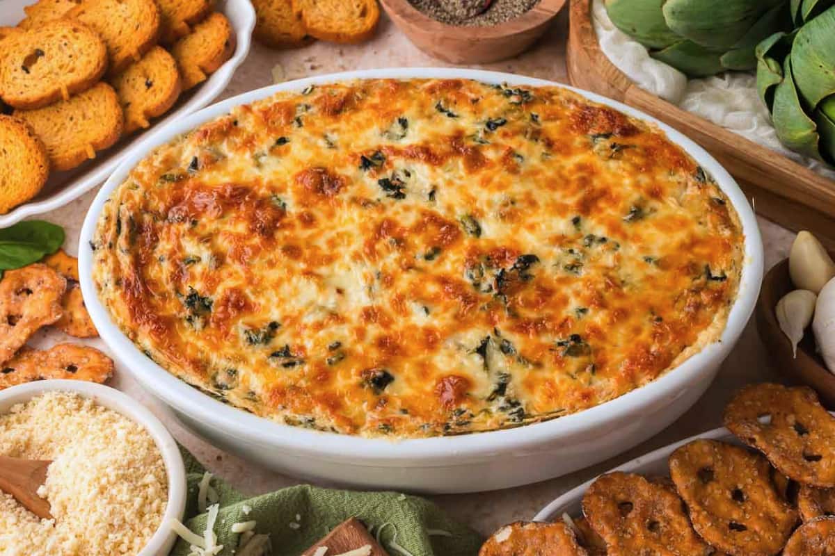 A dish of Baked Spinach Artichoke Dip.