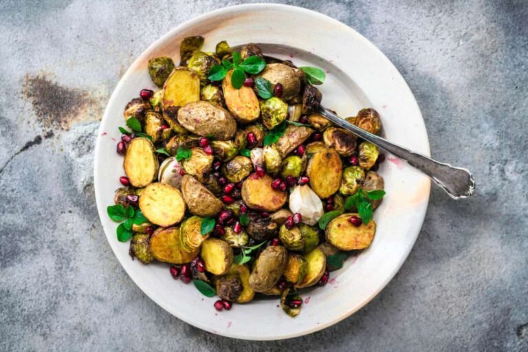 A dish of Spicy Roasted New Potatoes and Brussels Sprouts.