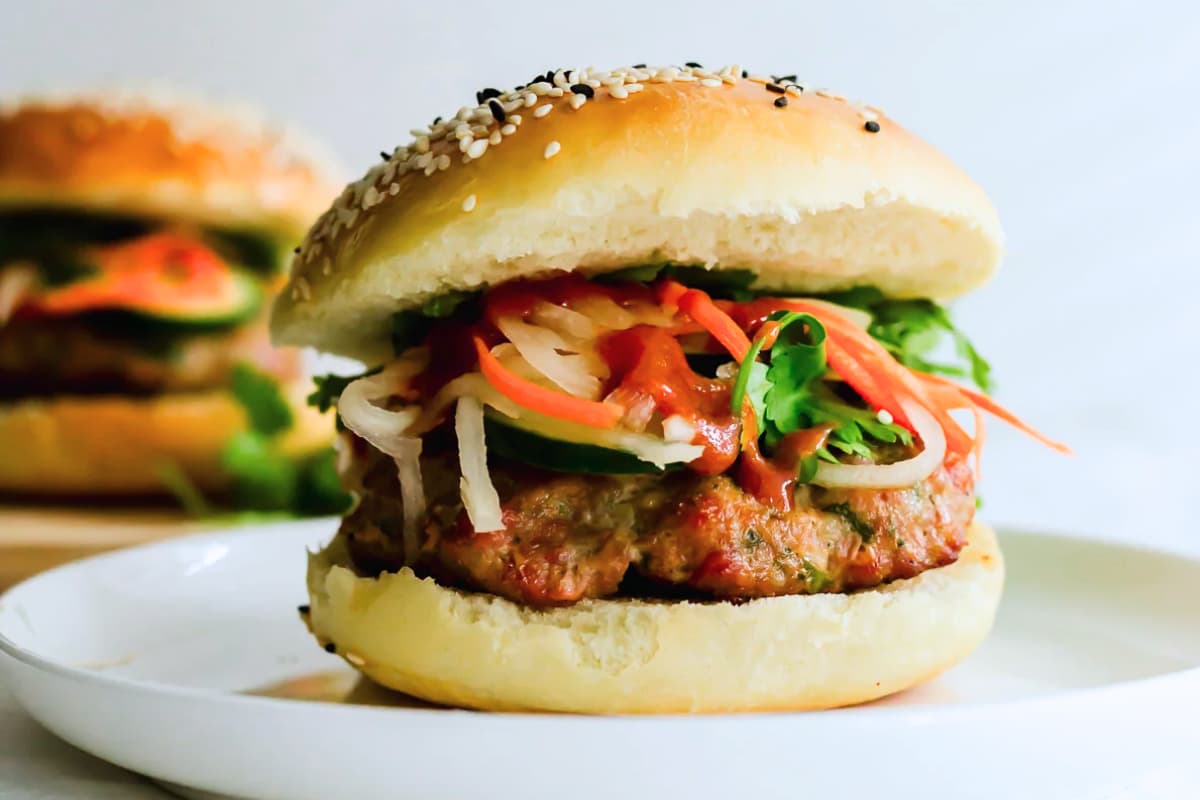 A plate of Bánh Mì-Inspired Pork Burgers.