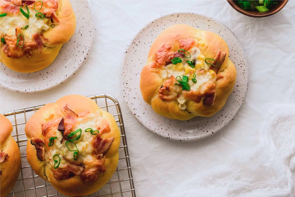 Dishes of Pumpkin Bacon and Corn Buns.
