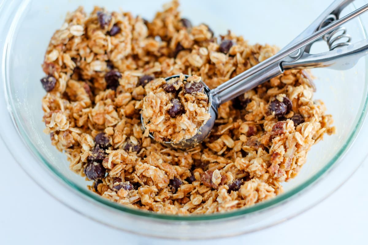 Scooping the mixture with a cookie scoop.