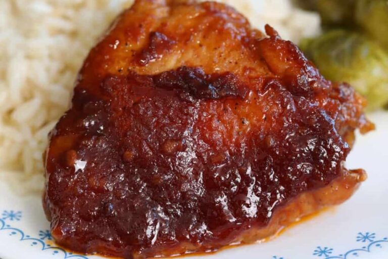 A plate of Saucy Crock Pot Chicken Thighs.