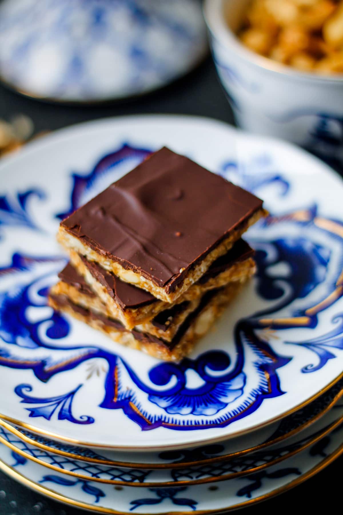 Vegan and gluten free chocolate cashew bars on a serving plate.